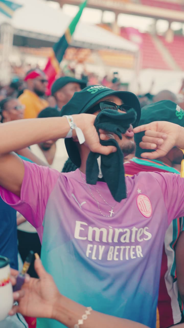 Festival-goers dancing in the stands at Sunrise